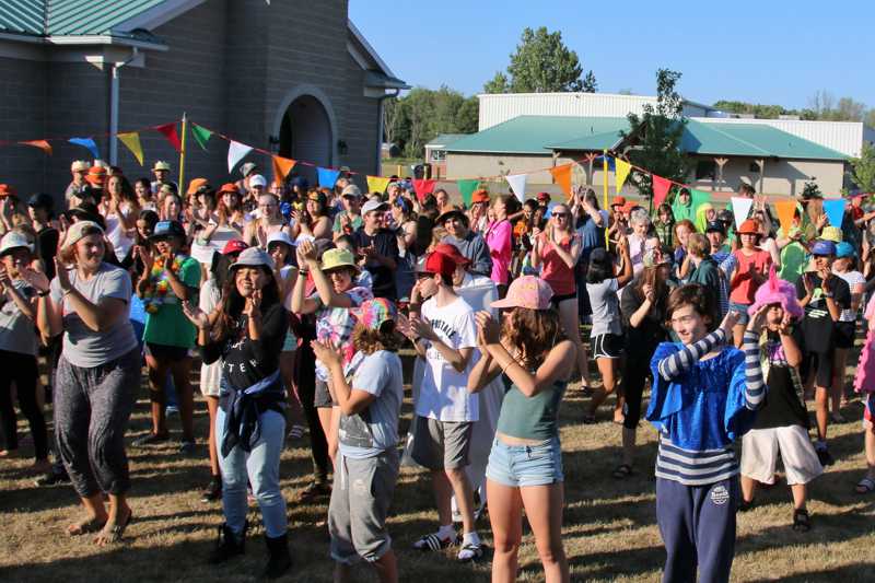 Group of campers dancing outside the dining hall